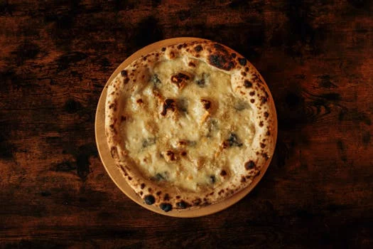 quattro stagioni pizza with four sections